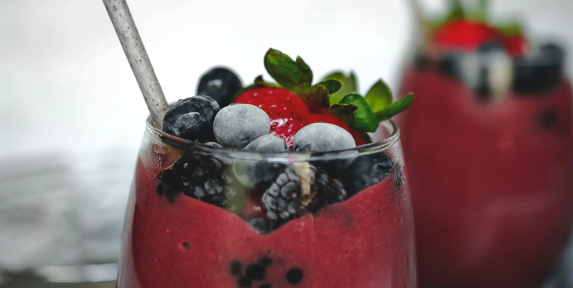 selective focus photography of glass of strawberry drink