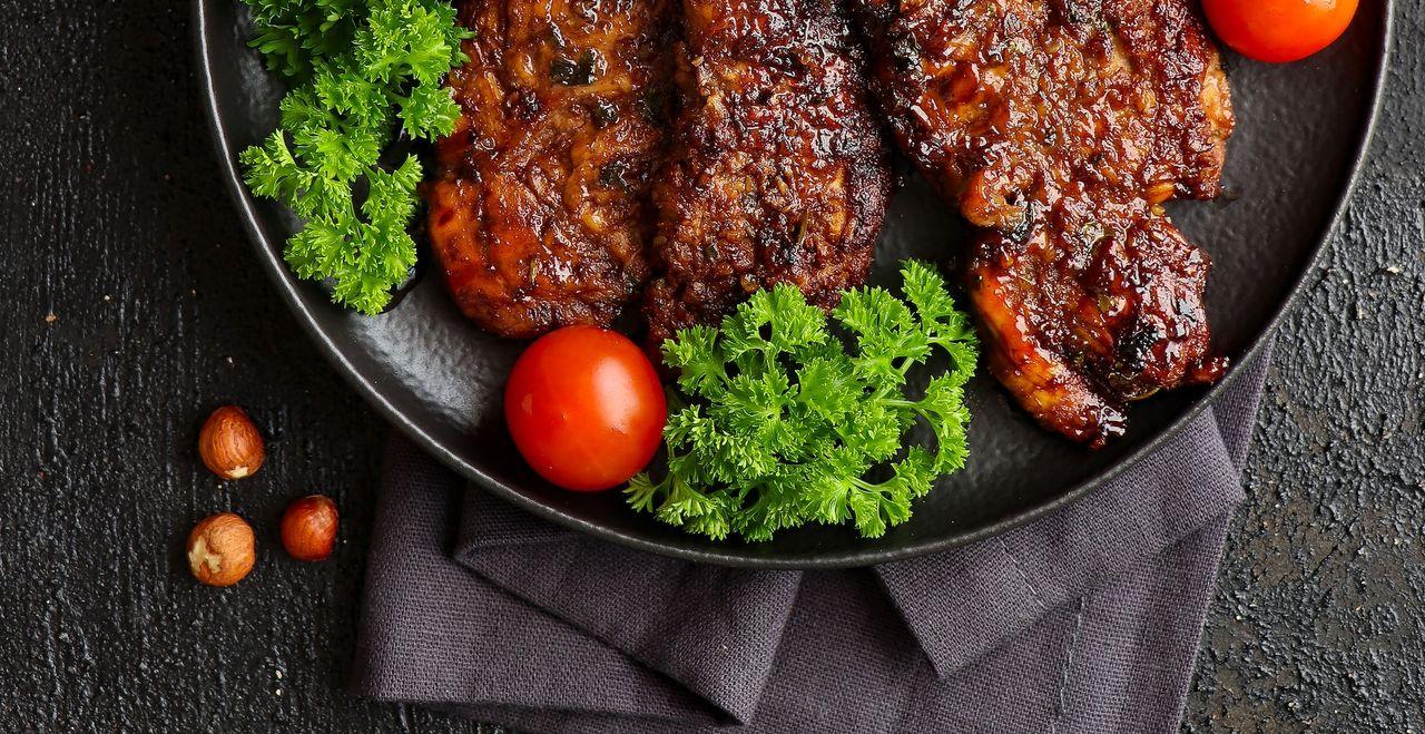 a plate of meat and vegetables on a table